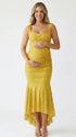 yellow jacquard maternity midi dress with corset bodice and high low hem