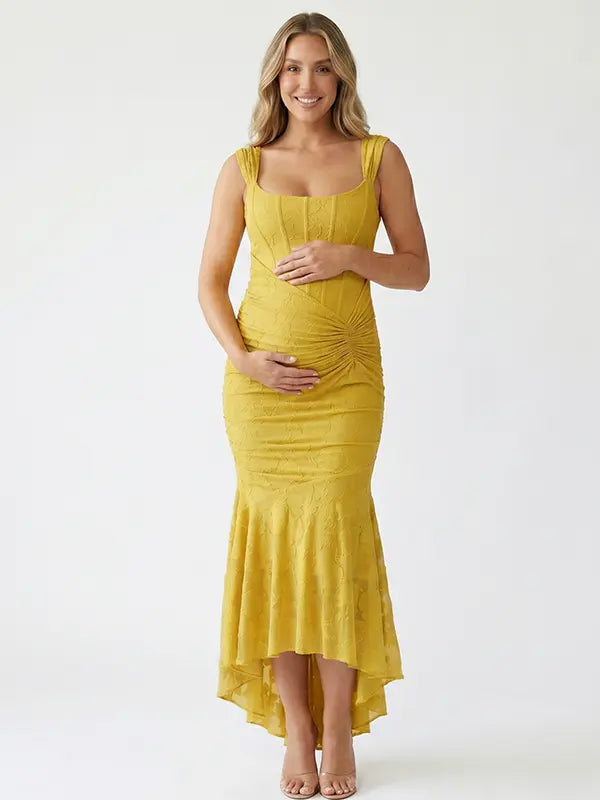 yellow jacquard maternity midi dress with corset bodice and high low hem