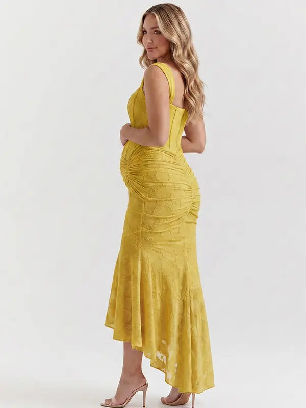 yellow jacquard maternity midi dress with corset bodice and high low hem