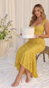 yellow jacquard maternity midi dress with corset bodice and high low hem