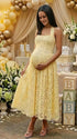 Elegant maternity photoshoot dress in yellow lace halter style