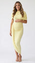 yellow ruched maternity midi dress with matching shawl and bodycon silhouette