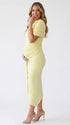 yellow ruched maternity midi dress with matching shawl and bodycon silhouette