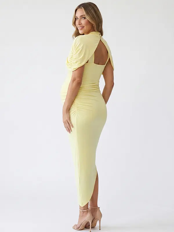 yellow ruched maternity midi dress with matching shawl and bodycon silhouette